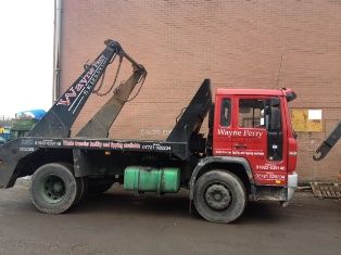 Red skip hire truck